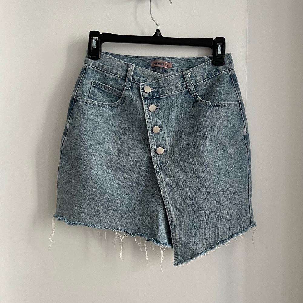 Asymmetrical jean skirt with button detail